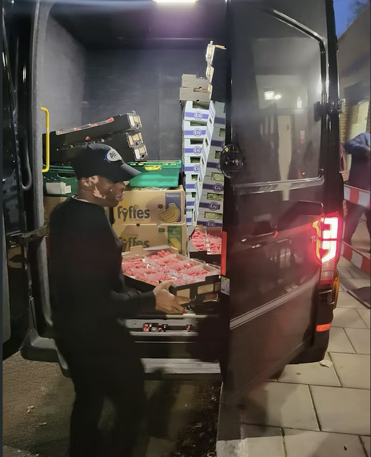 PSK founder loading fresh food deliveries into the van